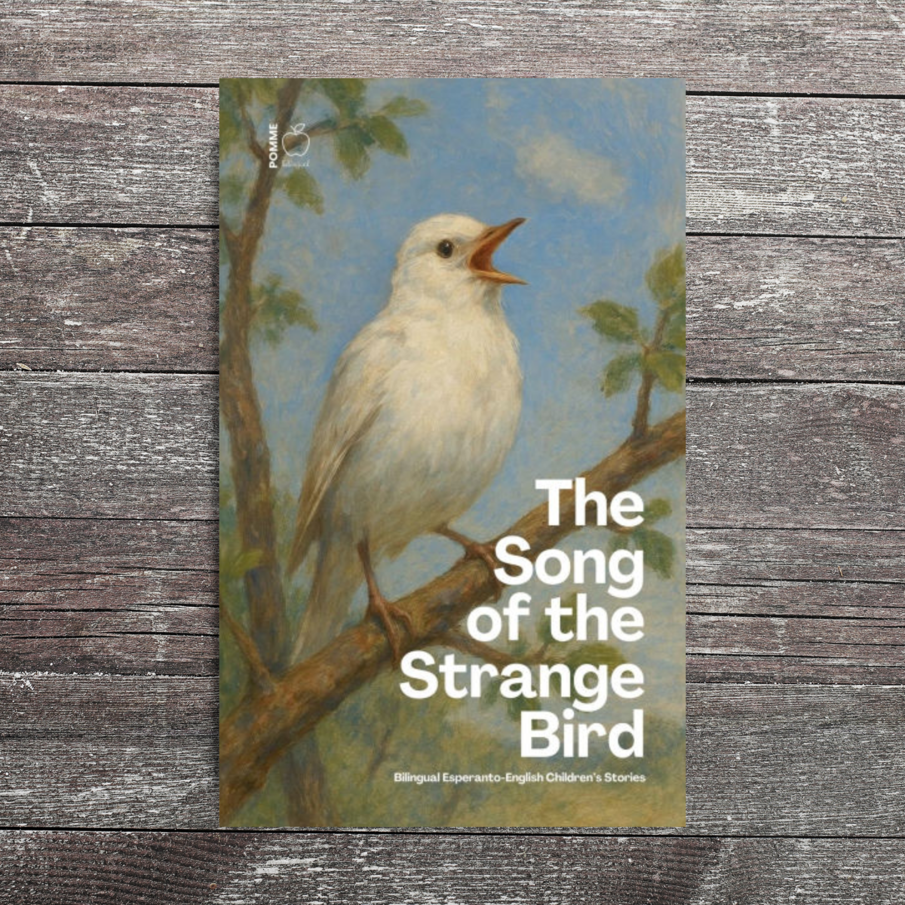A white bird perched on a branch with a blue sky background and foliage, titled "The Song of the Strange Bird."