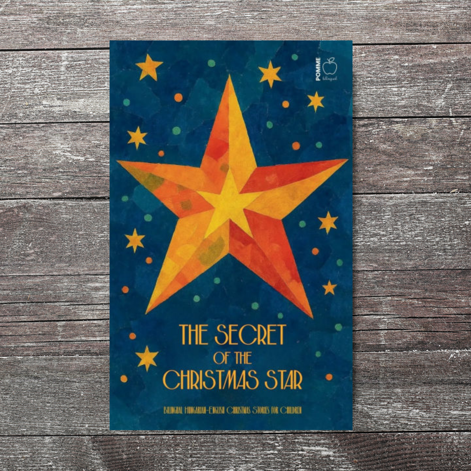 Colourful star design with the title "The Secret of the Christmas Star" and a blue background.