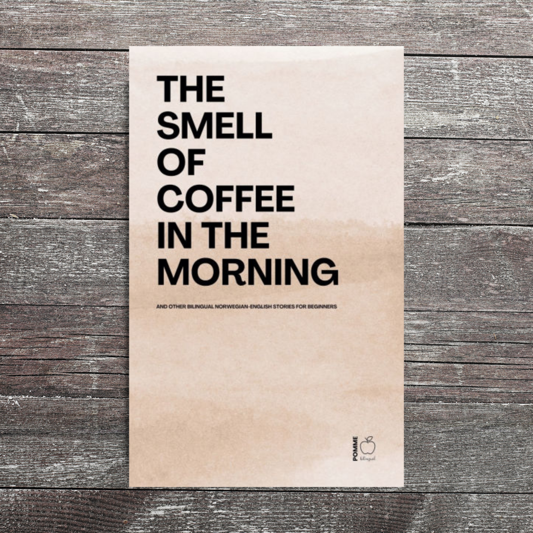 Poster with the text "The Smell of Coffee in the Morning" on a wooden background.
