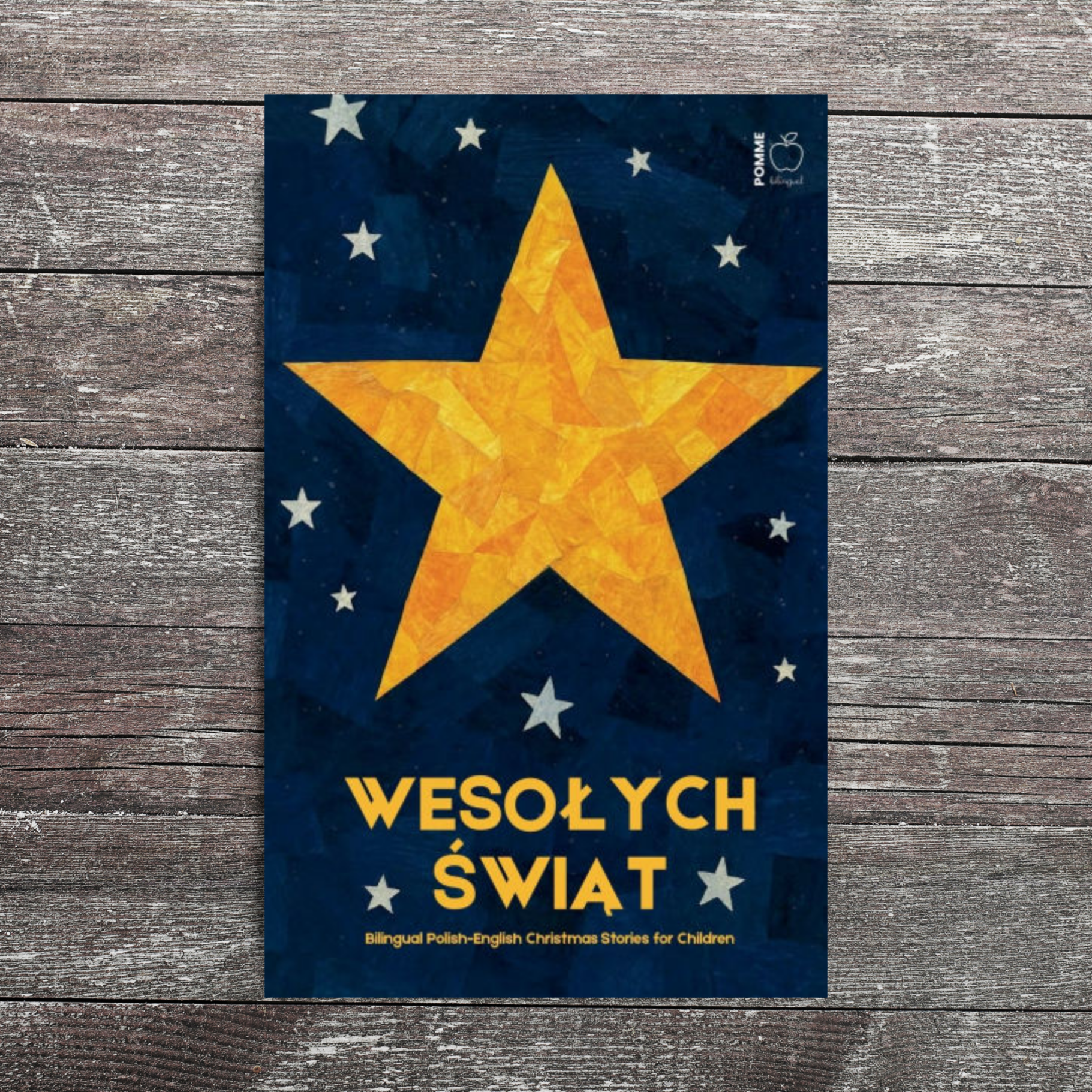 Yellow star on a blue background with text "Wesołych Świąt" in the foreground.