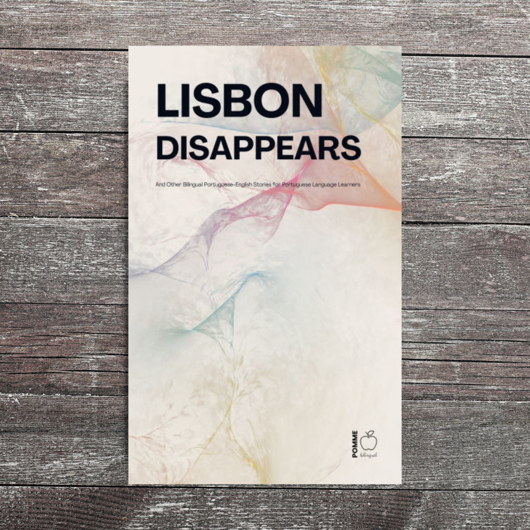 Book cover titled "Lisbon Disappears" featuring abstract, colourful patterns.