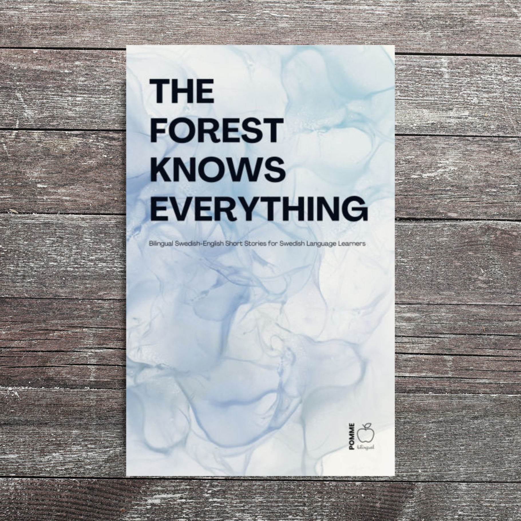 Book cover titled "The Forest Knows Everything" with a marbled blue and white background.