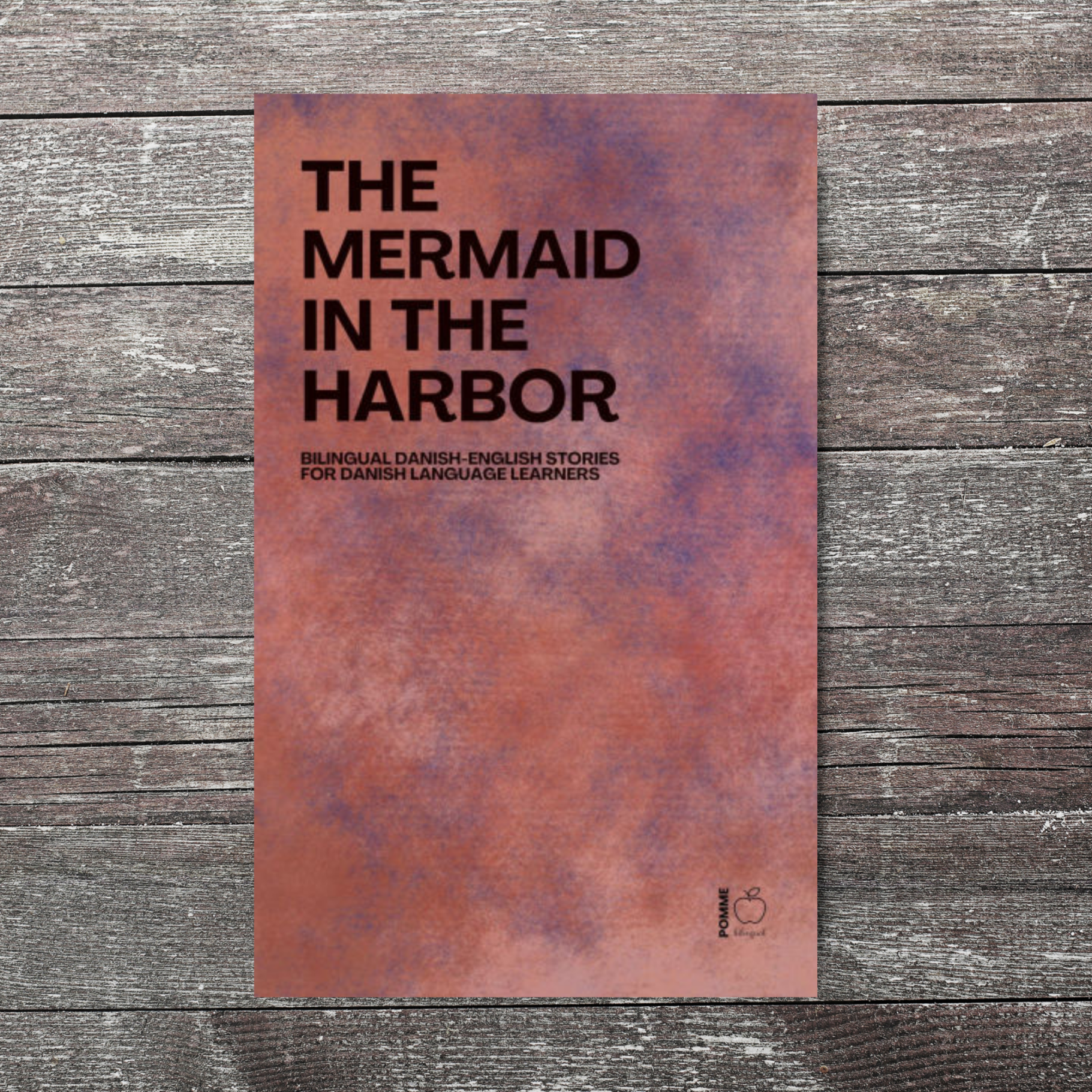 Text on a textured background reads "The Mermaid in the Harbor."