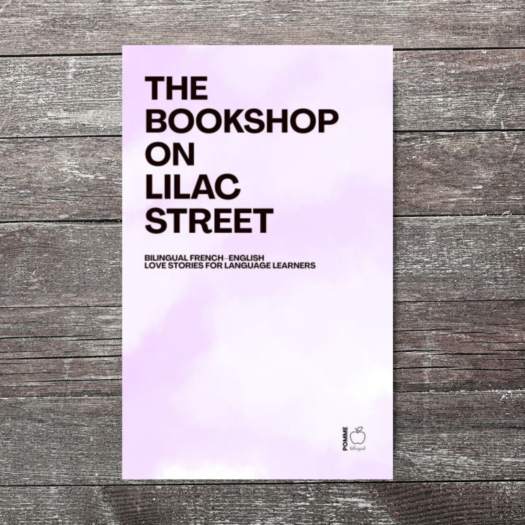 Cover of "The Bookshop on Lilac Street" with a lilac background and bold black text.